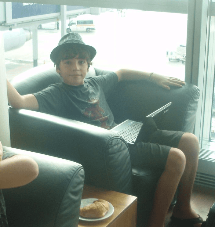 Adam Cohen Hillel as a child with a laptop.
